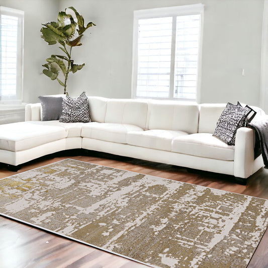 5' X 8' Ivory And Gold Abstract Area Rug