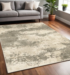 5' X 7' Beige And Grey Abstract Power Loom Stain Resistant Area Rug