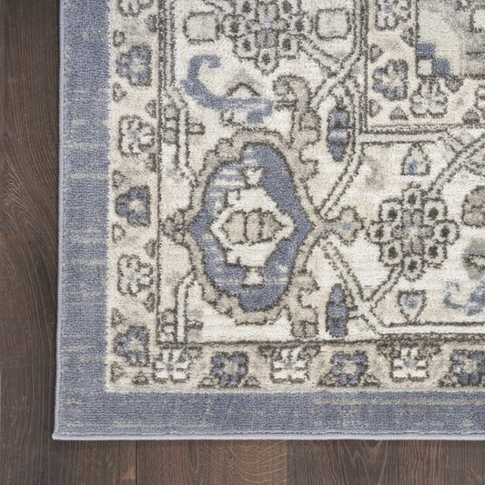 5' X 7' Blue and Ivory Medallion Power Loom Distressed Area Rug