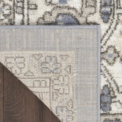 5' X 7' Blue and Ivory Medallion Power Loom Distressed Area Rug