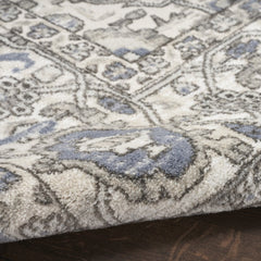 5' X 7' Blue and Ivory Medallion Power Loom Distressed Area Rug