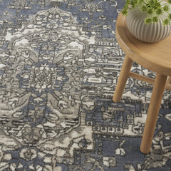 5' X 7' Blue and Ivory Medallion Power Loom Distressed Area Rug