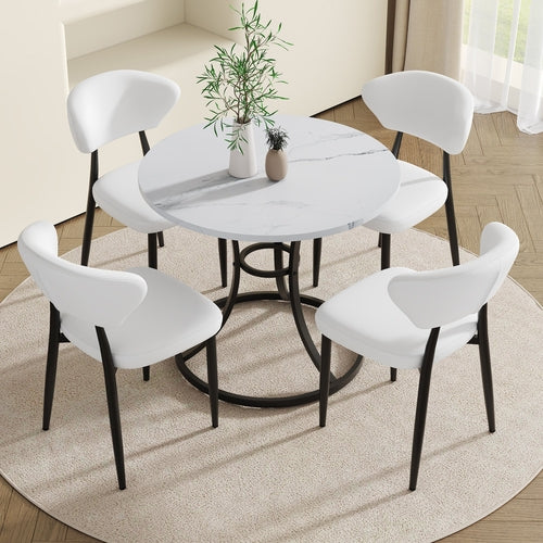 Table and chair set.A Modern Minimalist Circular Dining Table With A