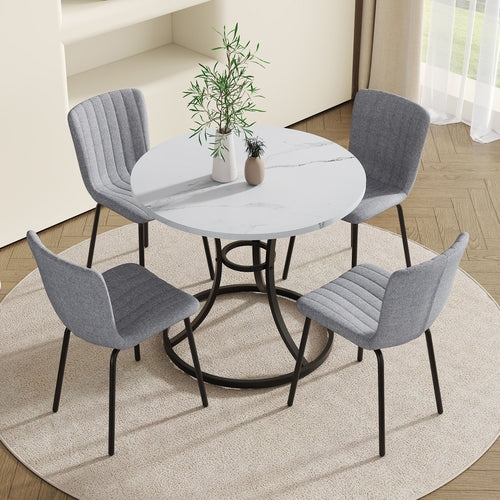 Table and chair set.A Modern Minimalist Circular Dining Table With A