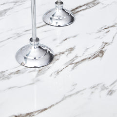 A modern, minimalist, and luxurious dining table with a white