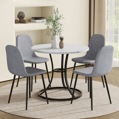 Table and chair set.A Modern Minimalist Circular Dining Table With A