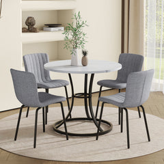 Table and chair set.A Modern Minimalist Circular Dining Table With A